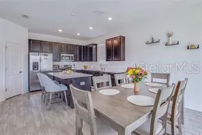 a view of a dining room with furniture and wooden floor
