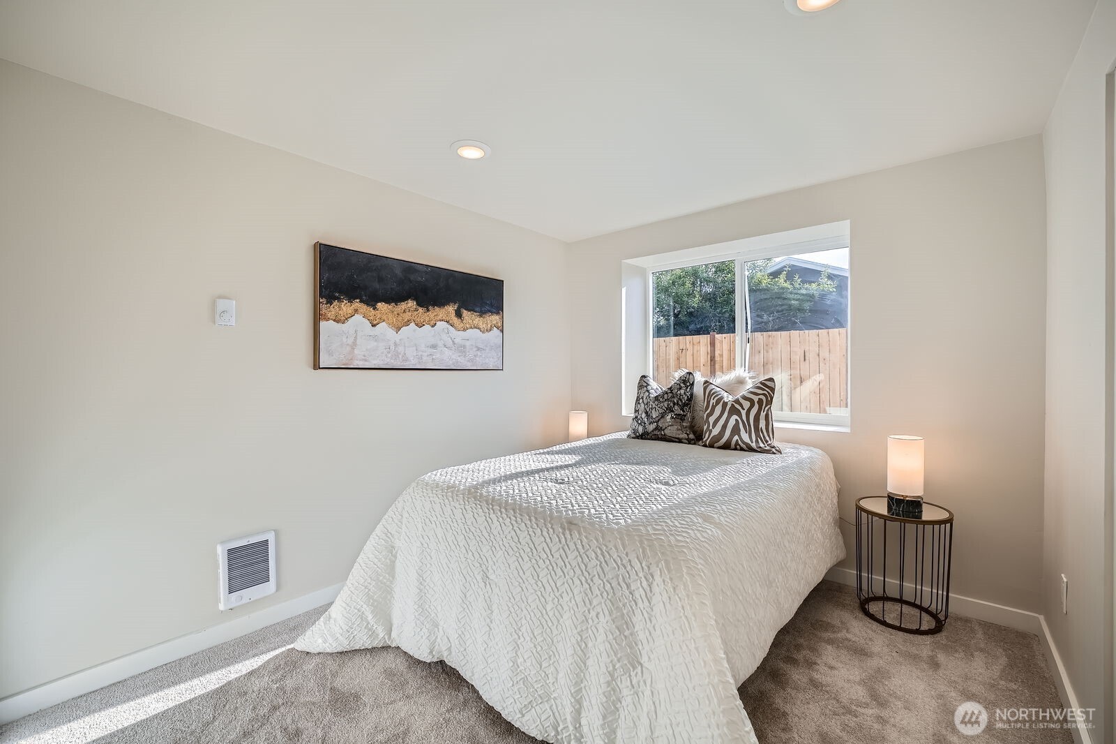 9206 33rd Ave Court South Lakewood, WA 98499 - Photo 11 of 21 a bed room with a bed a lamp and a window