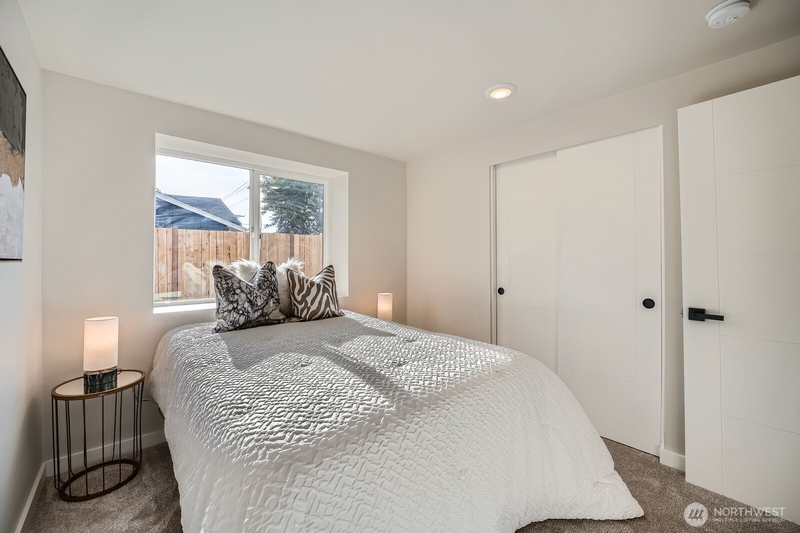 9206 33rd Ave Court South Lakewood, WA 98499 - Photo 12 of 21 a large bed sitting in a bedroom next to a window