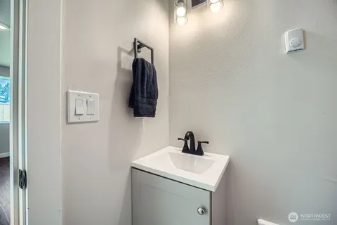 a bathroom with a sink and mirror
