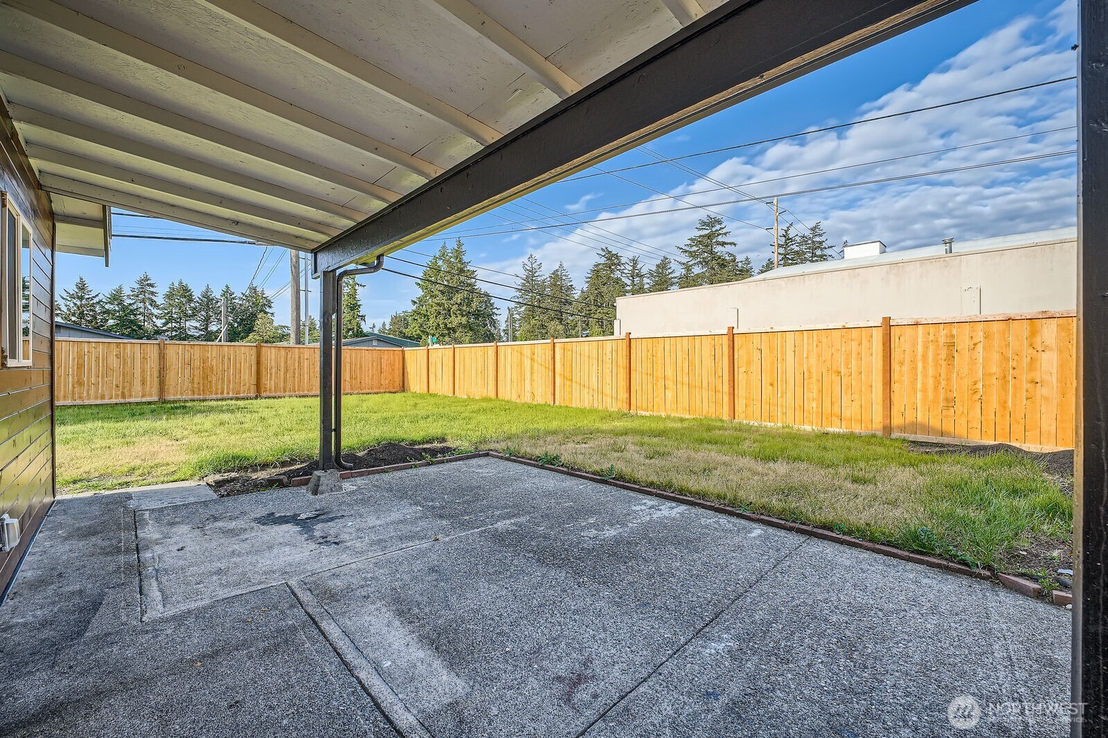 9206 33rd Ave Court South Lakewood, WA 98499 - Photo 18 of 21 a view of a backyard with grass