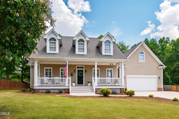 a view of a house with swimming pool and front view of a house
