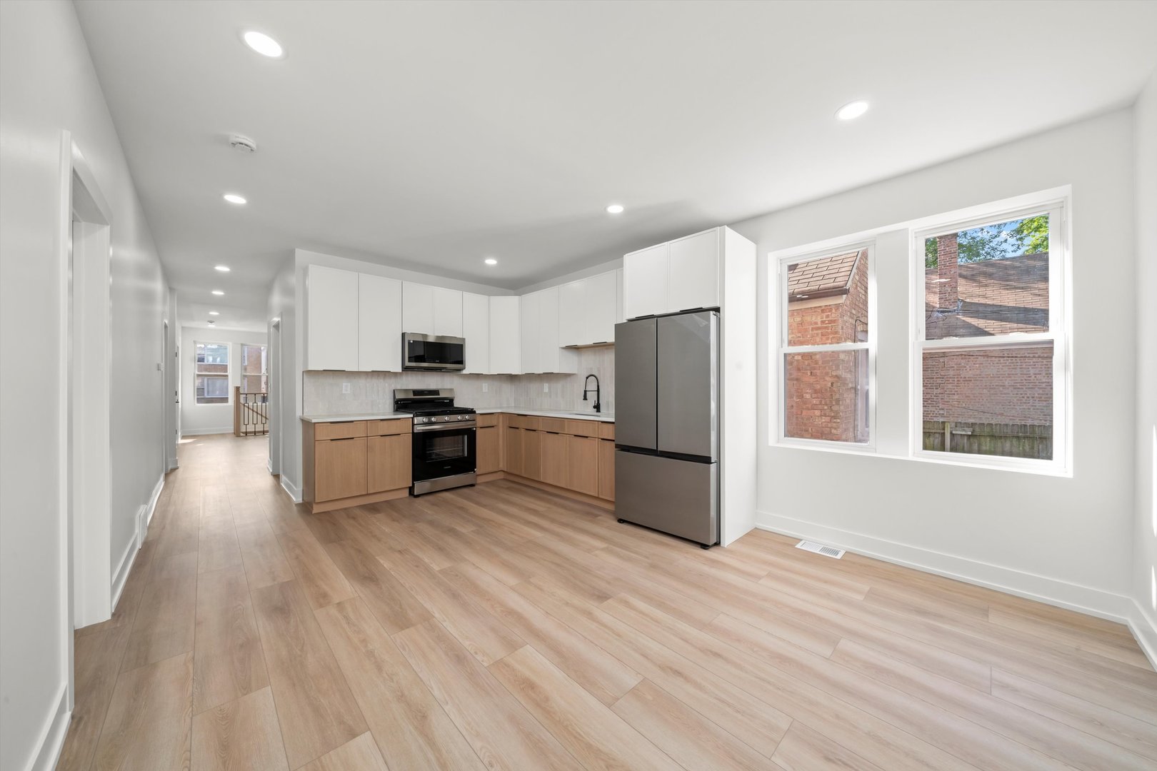 7150 South Talman Avenue, Unit 1 Chicago, IL 60629 - Photo 11 of 19 a kitchen with a refrigerator and a stove top oven