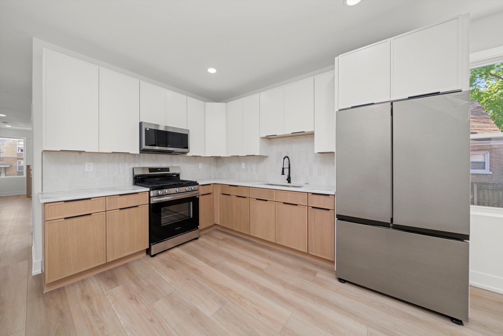 7150 South Talman Avenue, Unit 1 Chicago, IL 60629 - Photo 12 of 19 a kitchen with a refrigerator stove and microwave