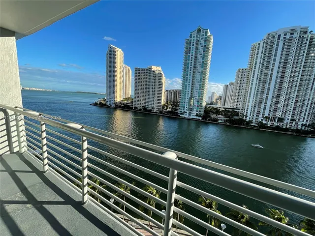 a view of roof deck with two chairs and a table