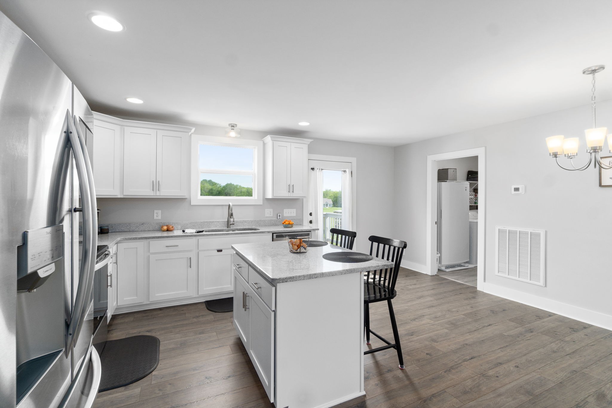 330 Woodruff Road Adams, TN 37010 - Photo 15 of 31 a kitchen with a sink a refrigerator and cabinets