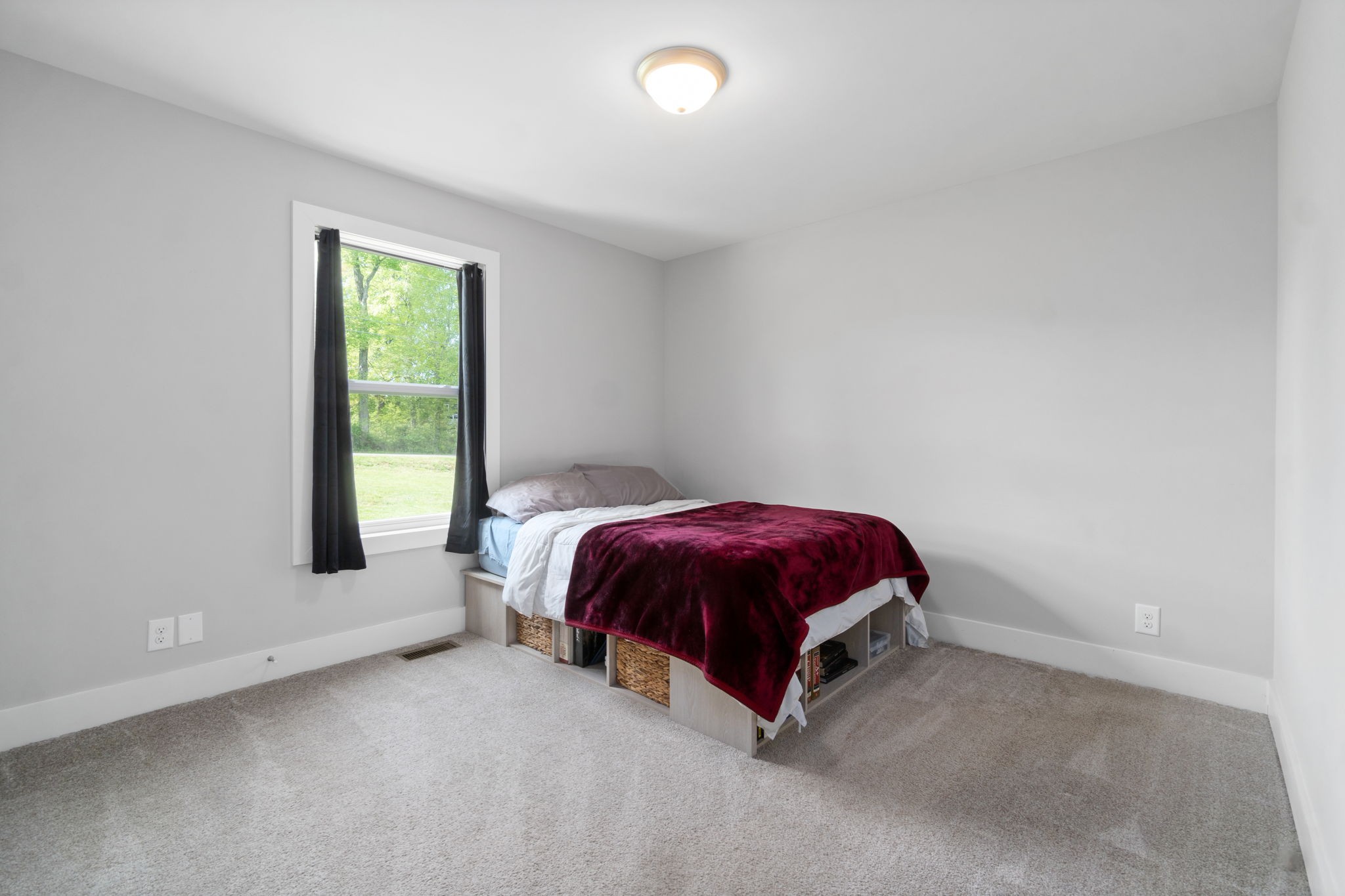 330 Woodruff Road Adams, TN 37010 - Photo 20 of 31 a spacious bedroom with a bed and a window
