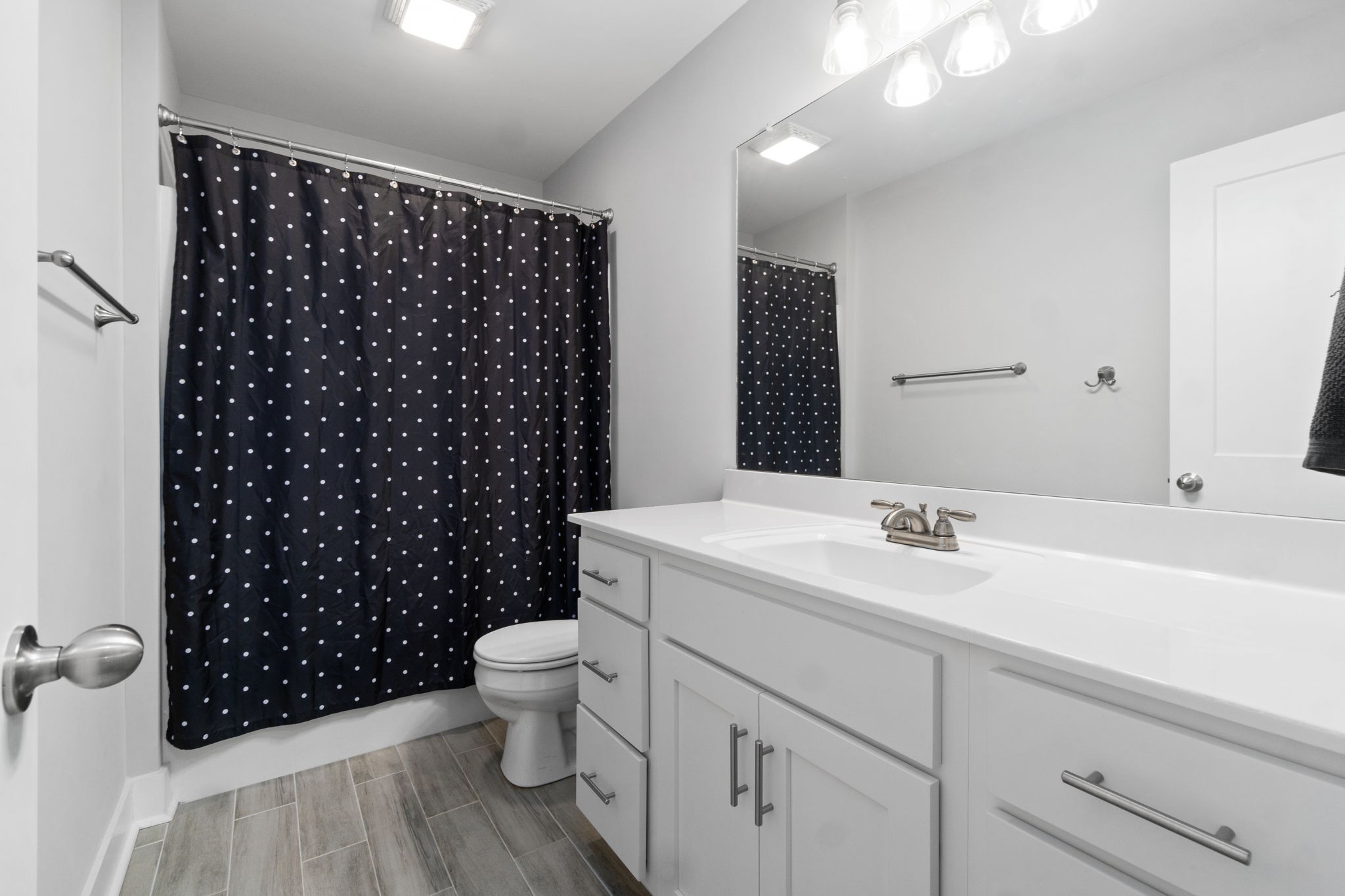 330 Woodruff Road Adams, TN 37010 - Photo 21 of 31 a bathroom with a sink a toilet a shower and a mirror