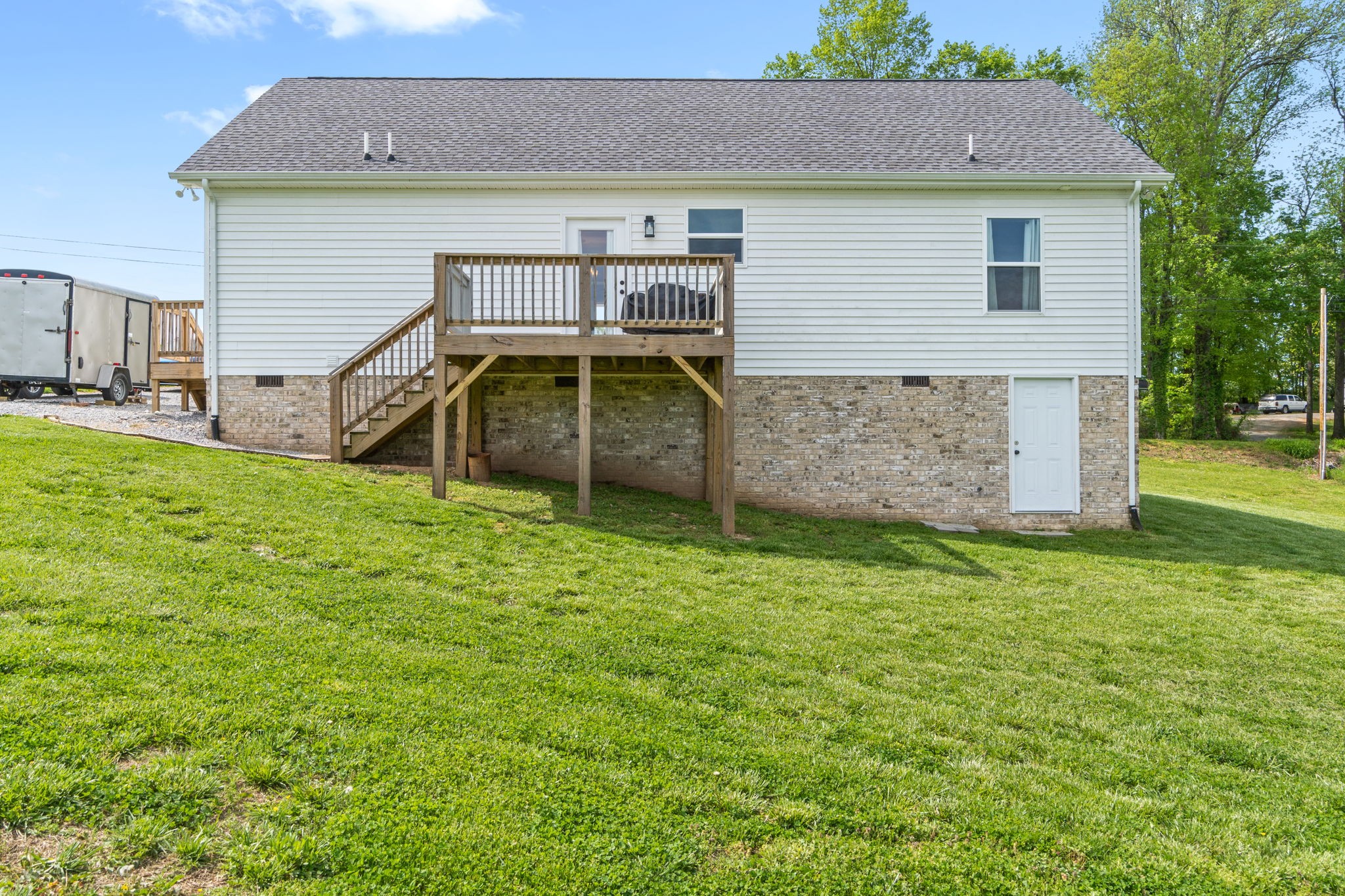 330 Woodruff Road Adams, TN 37010 - Photo 30 of 31 a front view of a house with a garden