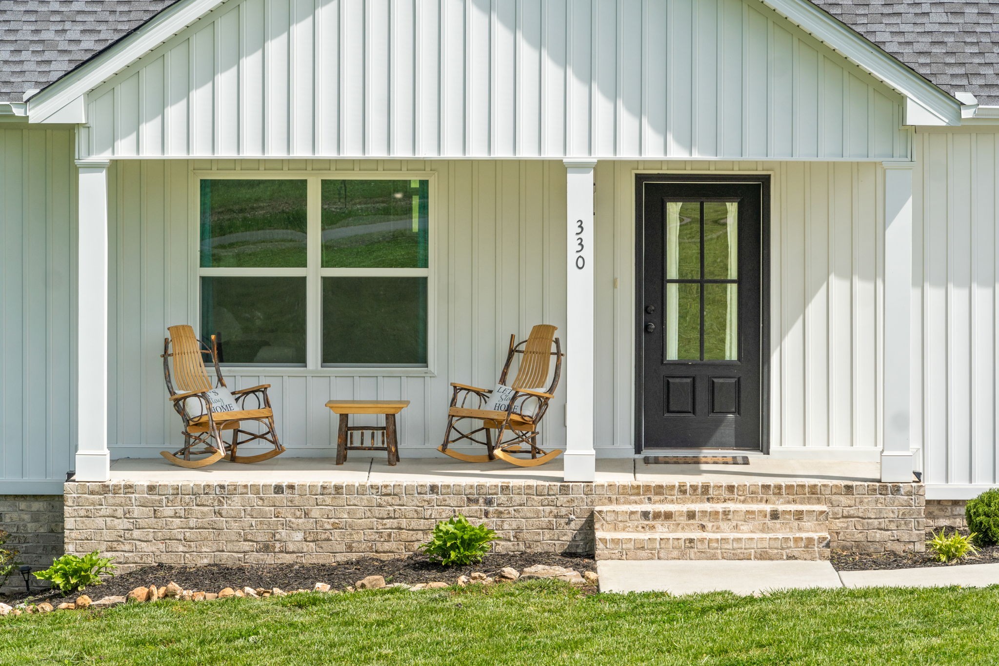 330 Woodruff Road Adams, TN 37010 - Photo 3 of 31 a view of building with glass door and garden