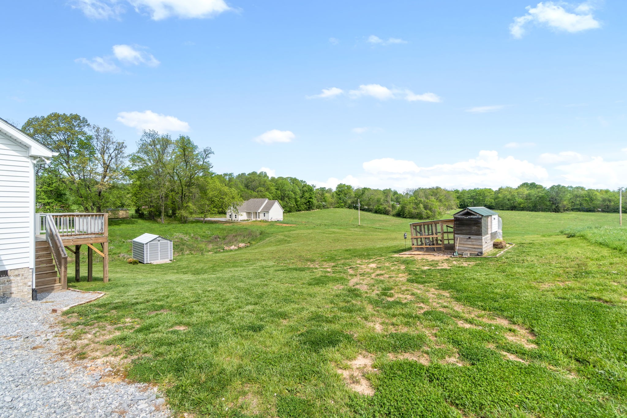 330 Woodruff Road Adams, TN 37010 - Photo 31 of 31 a backyard of a house with table and chairs