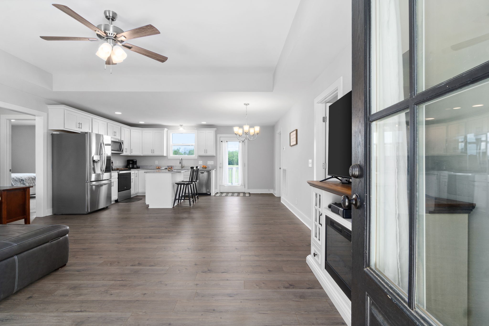 330 Woodruff Road Adams, TN 37010 - Photo 5 of 31 a view of kitchen living room with stainless steel appliances kitchen island stove and refrigerator