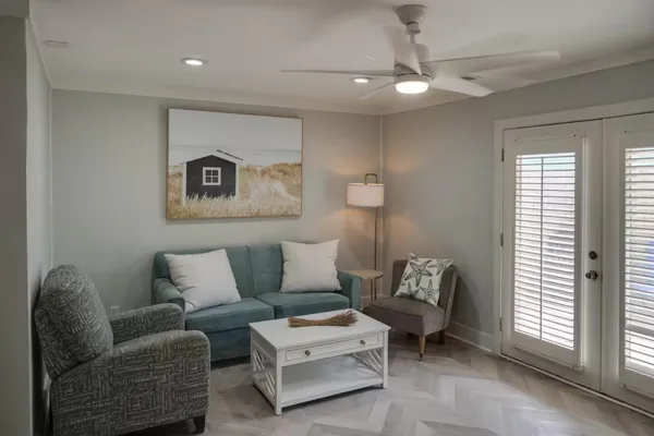 a living room with furniture and a window