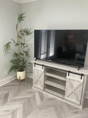 a living room with furniture and white walls