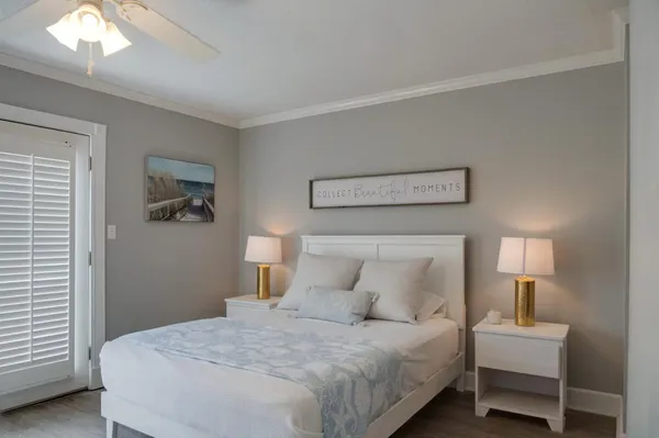 a bedroom with a bed and a lamp