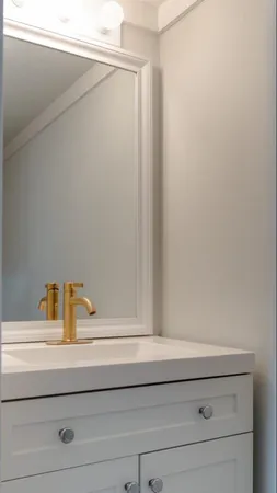 a bathroom with a window and vanity