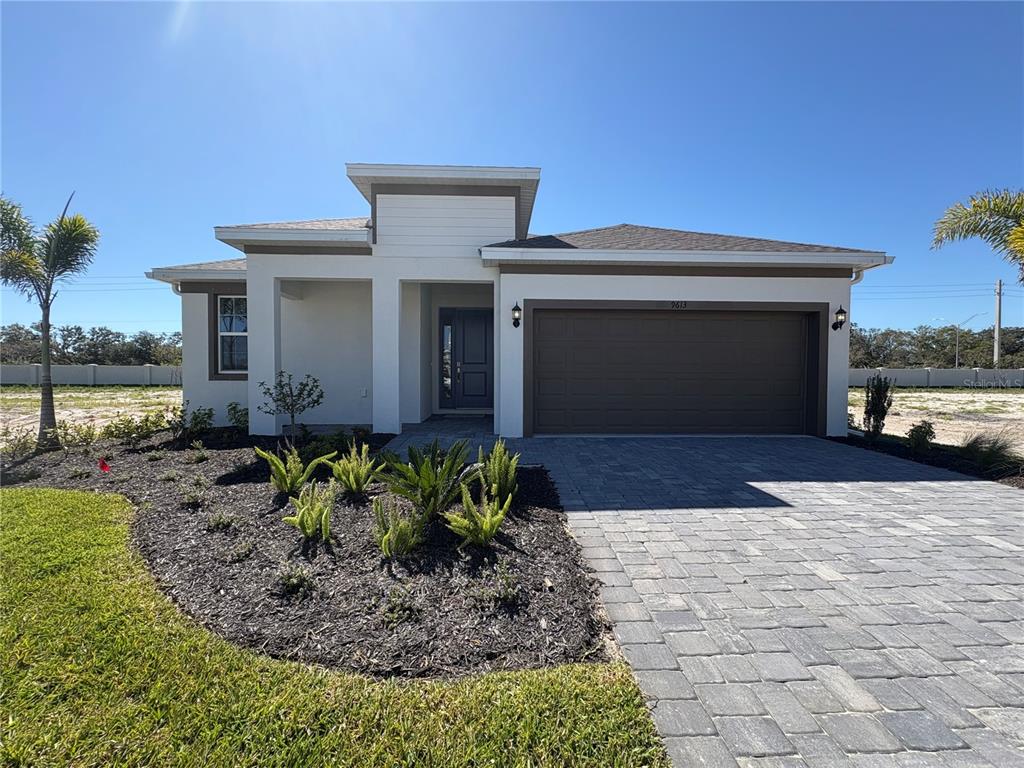 9613 Vibrant Lane Venice, FL 34292 - Photo 1 of 1 a front view of a house with garden