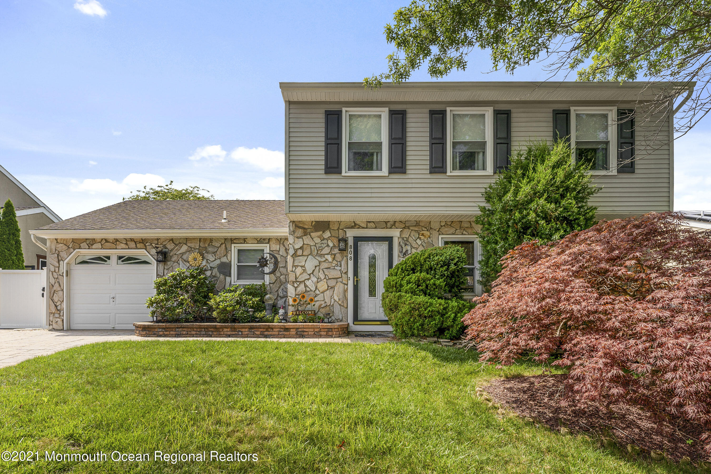front view of a house with a yard