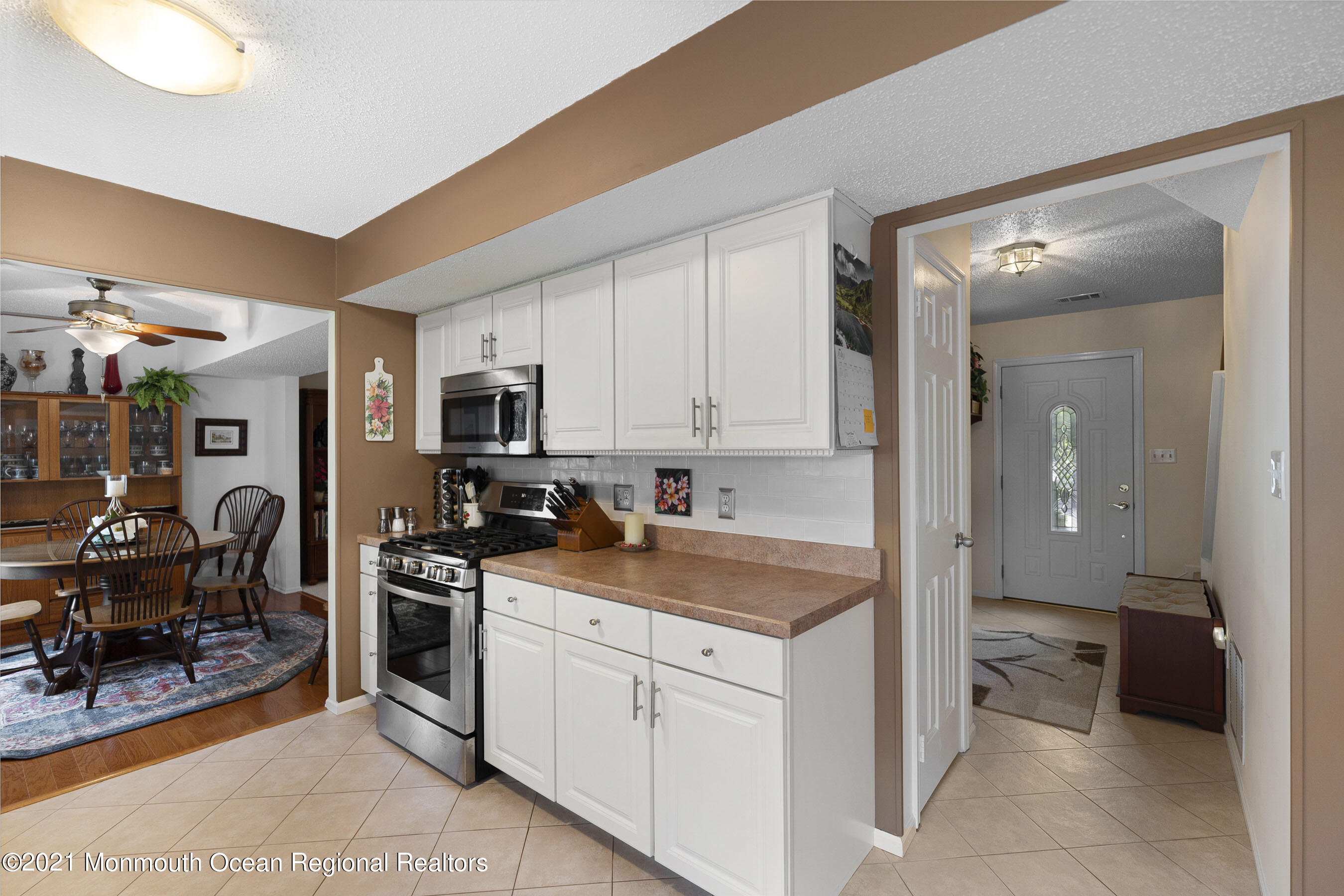 808 Constitution Drive Brick, NJ 08724 - Photo 11 of 27 a kitchen that has a lot of cabinets in it and wooden floors