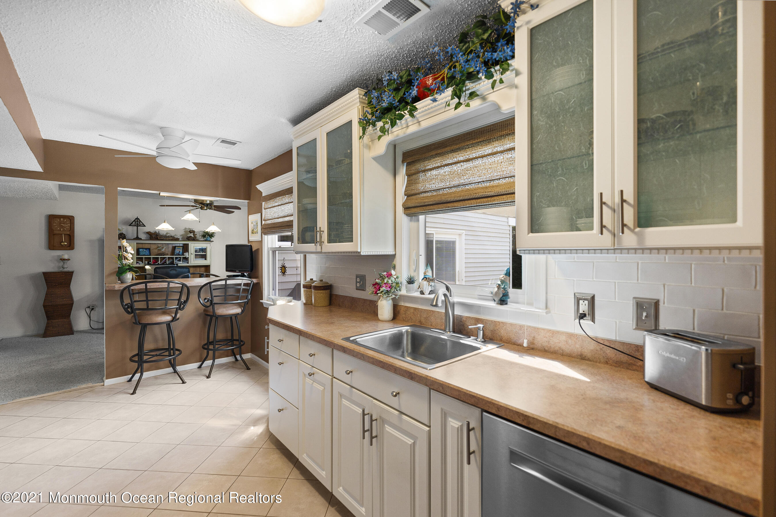 808 Constitution Drive Brick, NJ 08724 - Photo 13 of 27 a kitchen with granite countertop a sink and a stove top oven