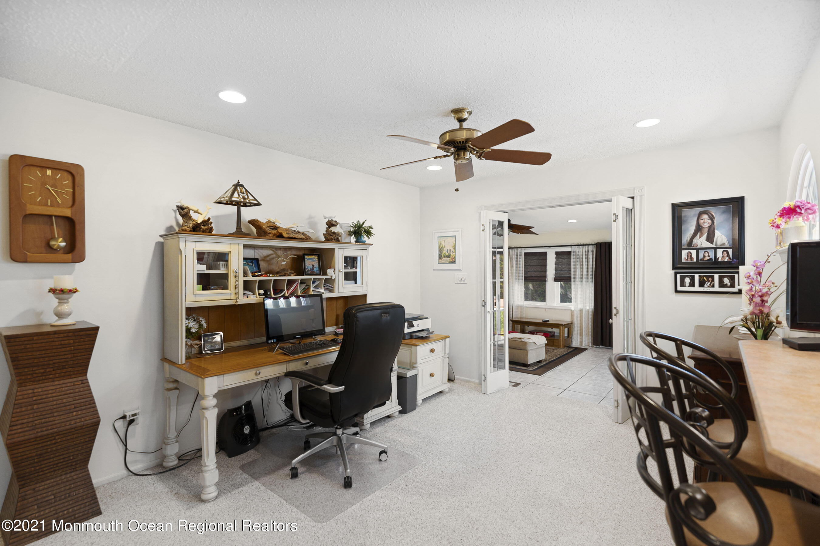 808 Constitution Drive Brick, NJ 08724 - Photo 15 of 27 a view of a workspace with furniture and a livingroom