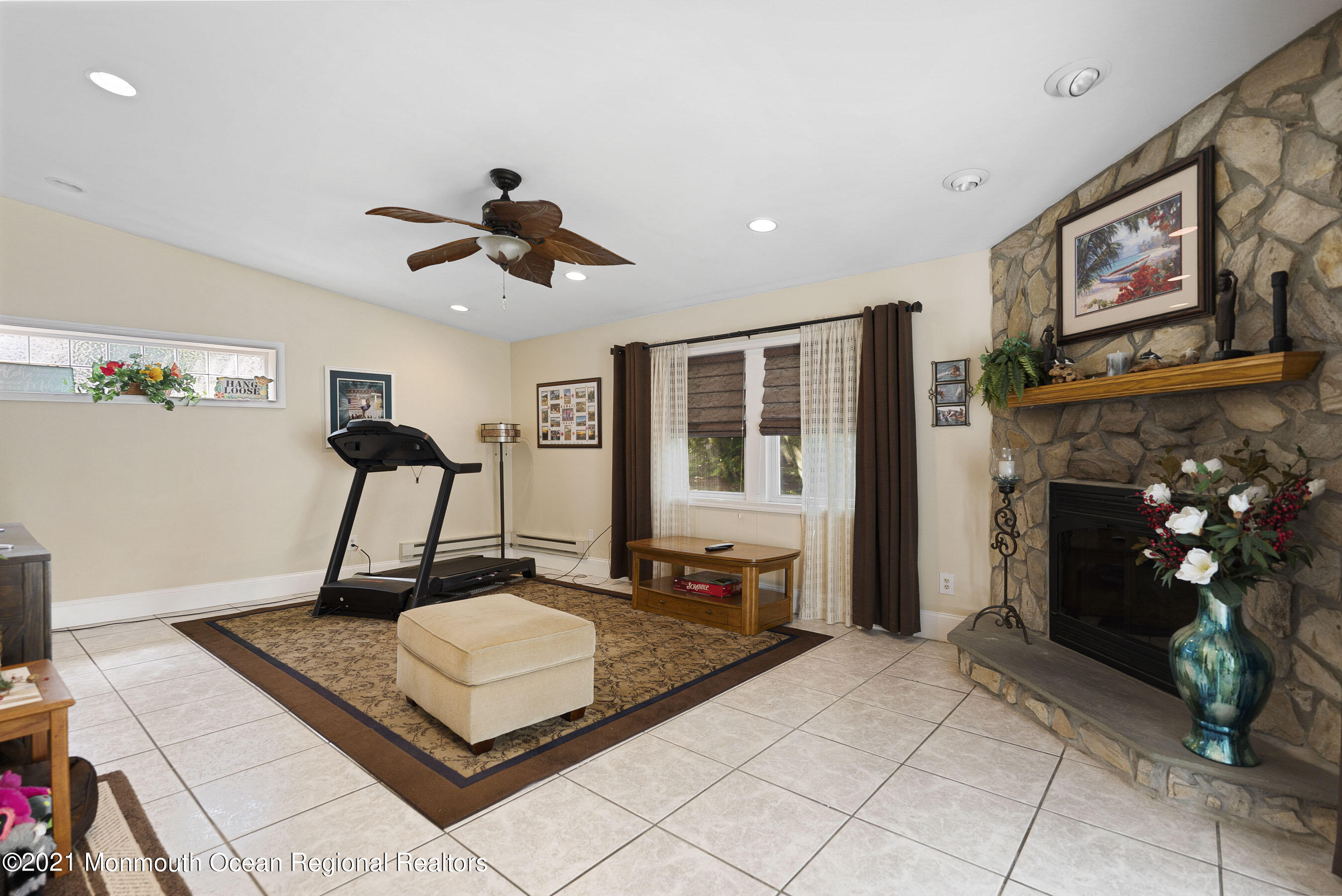 808 Constitution Drive Brick, NJ 08724 - Photo 16 of 27 a living room with fireplace furniture and a flat screen tv