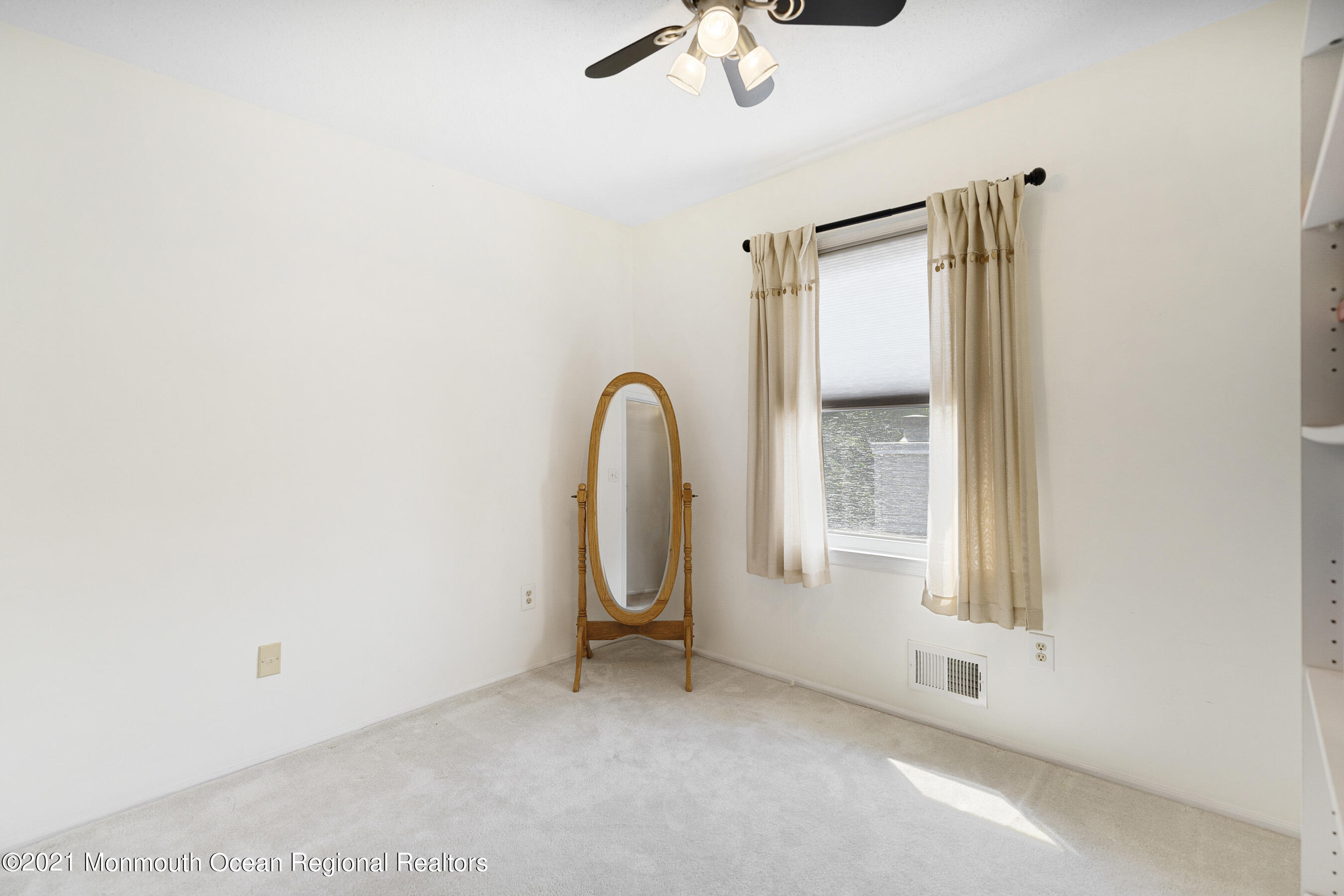 808 Constitution Drive Brick, NJ 08724 - Photo 24 of 27 a view of a room that has a window and a ceiling fan