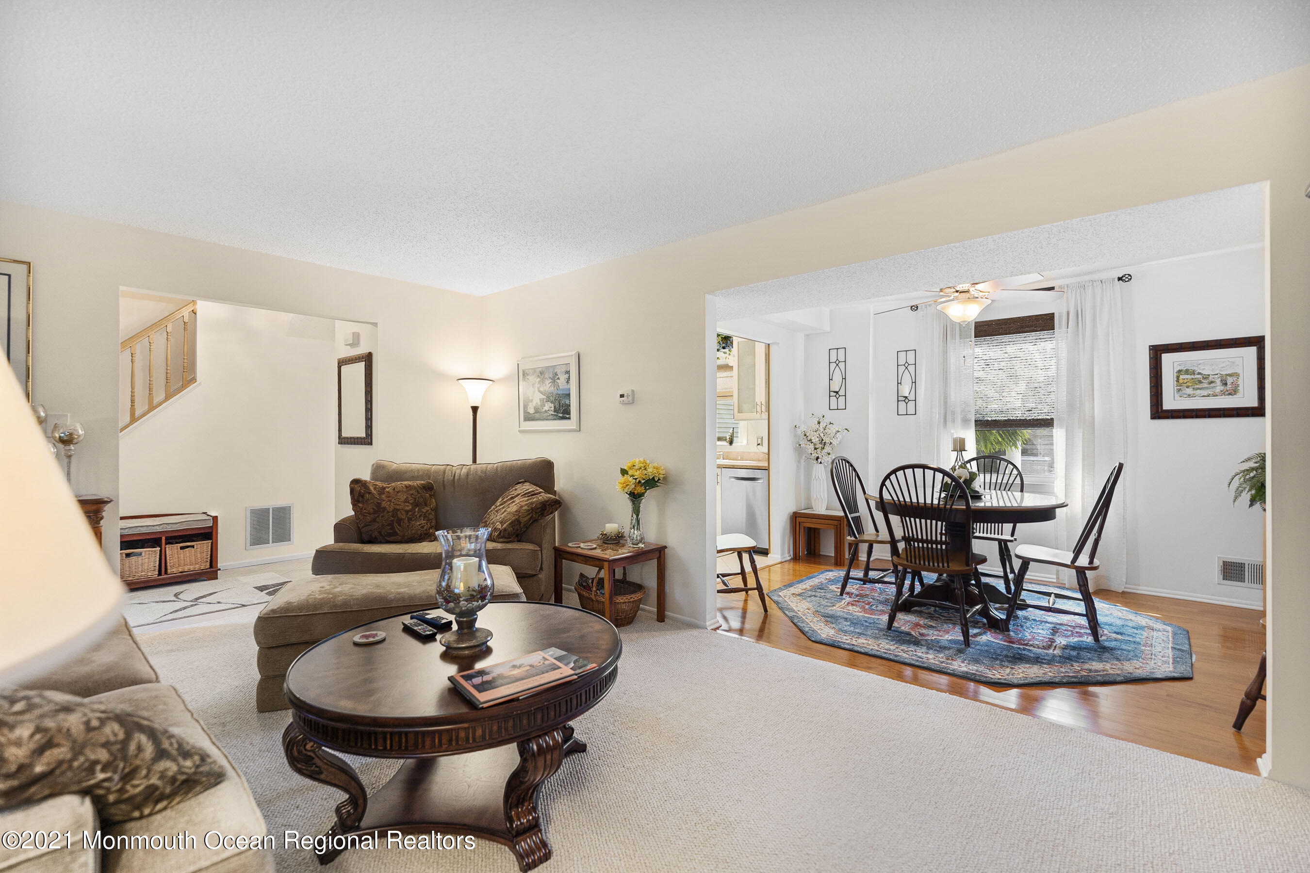 808 Constitution Drive Brick, NJ 08724 - Photo 6 of 27 a living room with furniture a dining table and chairs with wooden floor