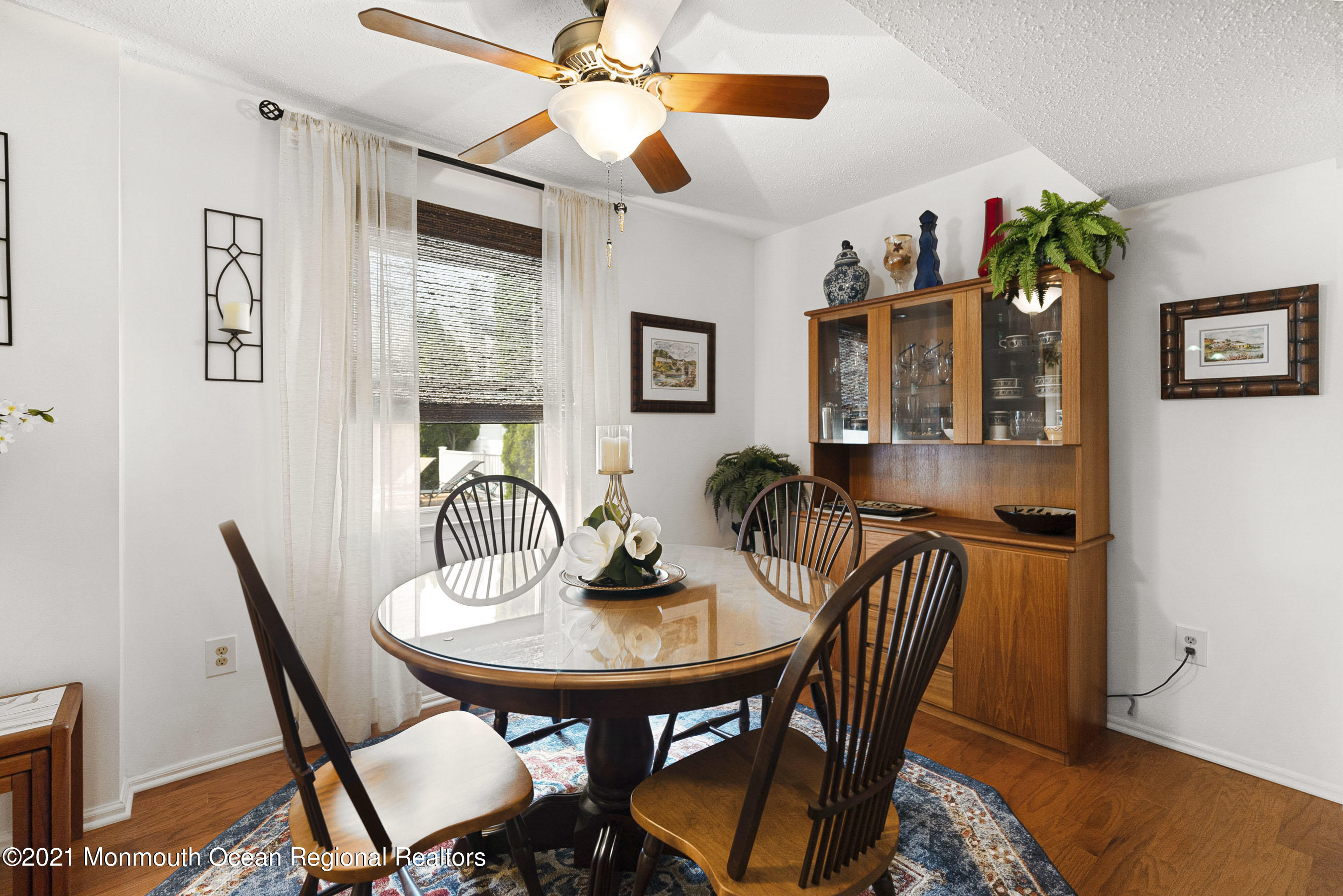 808 Constitution Drive Brick, NJ 08724 - Photo 8 of 27 a view of a dining room with furniture and wooden floor