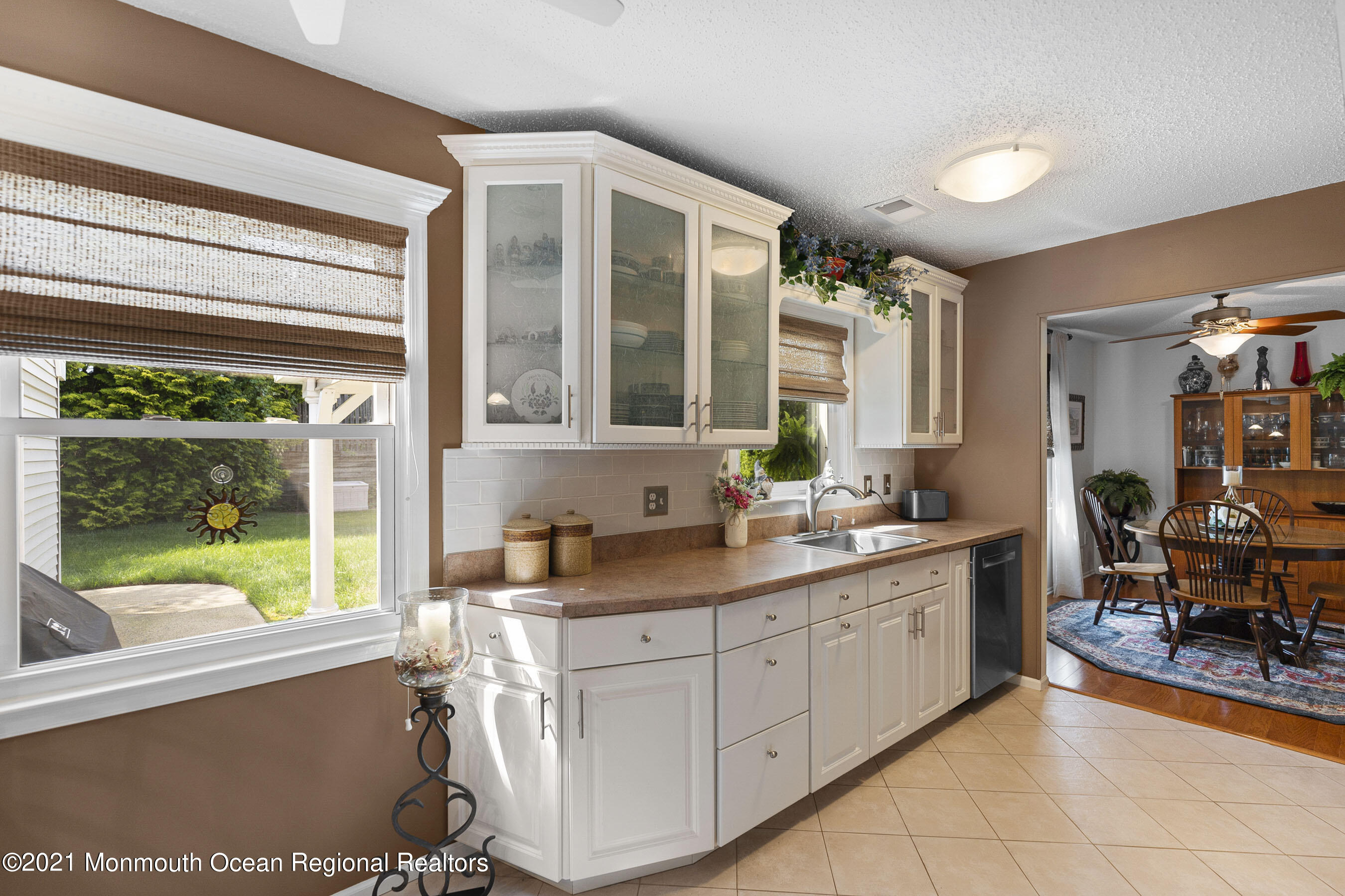 808 Constitution Drive Brick, NJ 08724 - Photo 10 of 27 a view of a kitchen with a sink and a large window