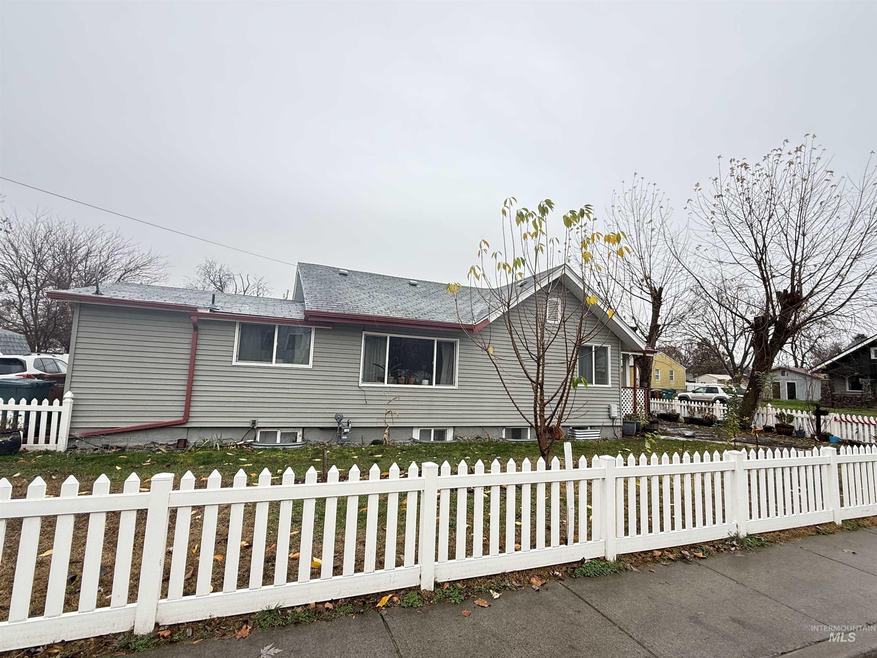 601 12th Street Clarkston, WA 99403 - Photo 21 of 21 View of front of home featuring a fenced front yard and a shingled roof