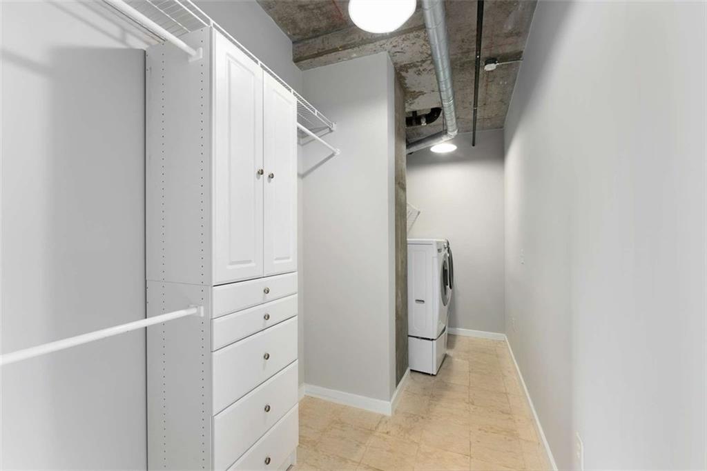 115 West Peachtree Street Northwest, Unit 704 Atlanta, GA 30313 - Photo 14 of 35 a view of walk in closet with white walls