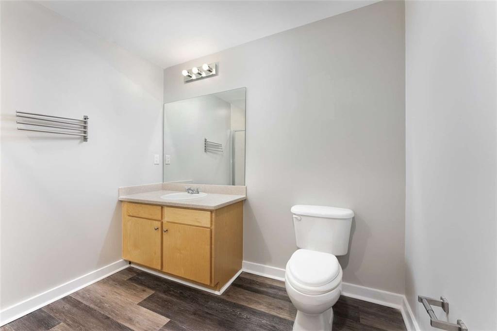 115 West Peachtree Street Northwest, Unit 704 Atlanta, GA 30313 - Photo 16 of 35 a bathroom with a toilet sink and mirror
