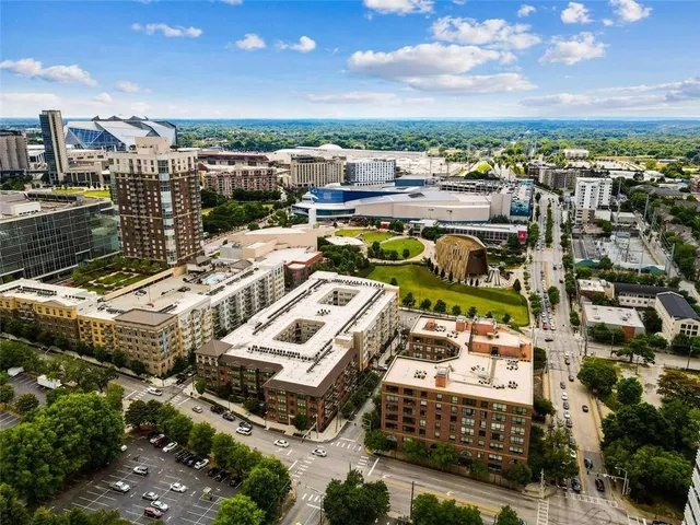 an aerial view of residential houses with outdoor space