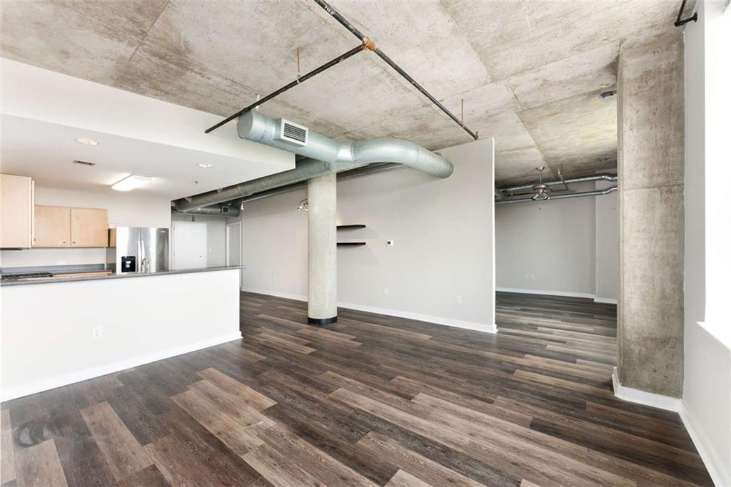 115 West Peachtree Street Northwest, Unit 704 Atlanta, GA 30313 - Photo 8 of 35 a view of empty room with wooden floor