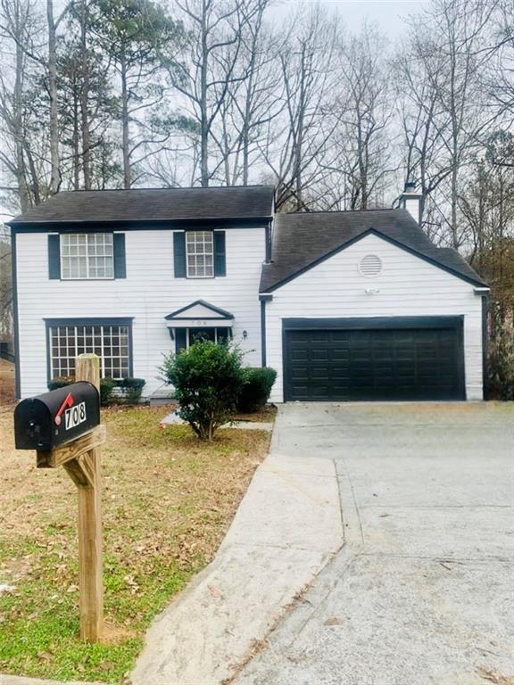 708 Stonebridge Crescent Lithonia, GA 30058 - Photo 1 of 1 a front view of a house with a yard