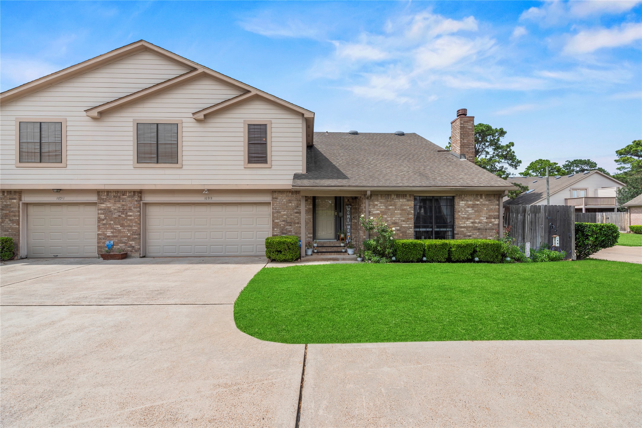 16913 Chapel Pines Drive, Unit 126 Spring, TX 77379 - Photo 3 of 27 2 car attached garage. Beautifully maintained front yard neatly landscaped.