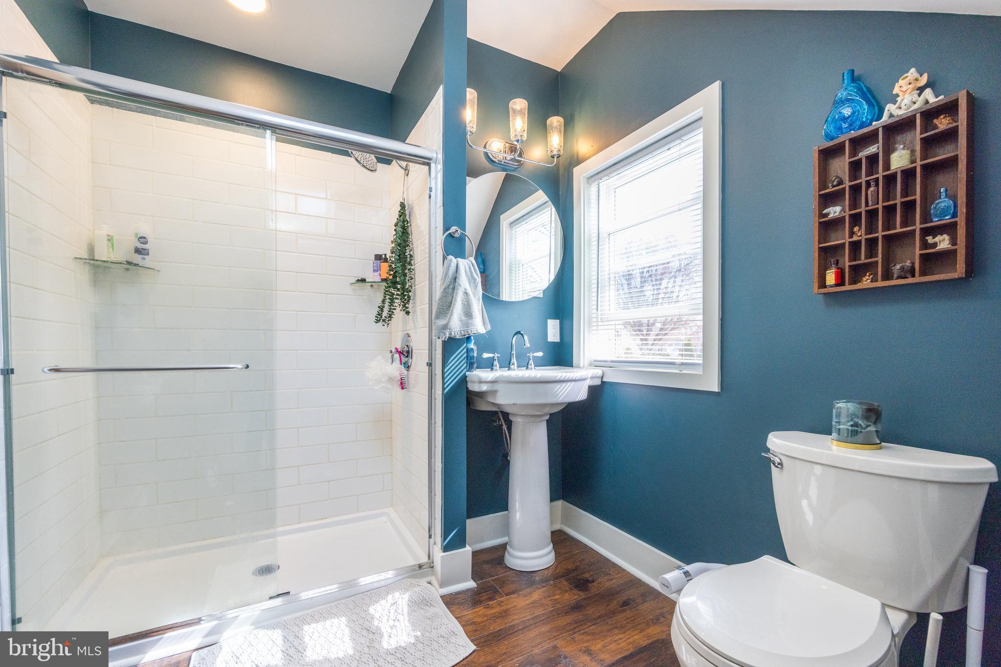 178 Devon Drive West Deptford, NJ 08096 - Photo 22 of 29 a bathroom with a sink a toilet a shower and a window