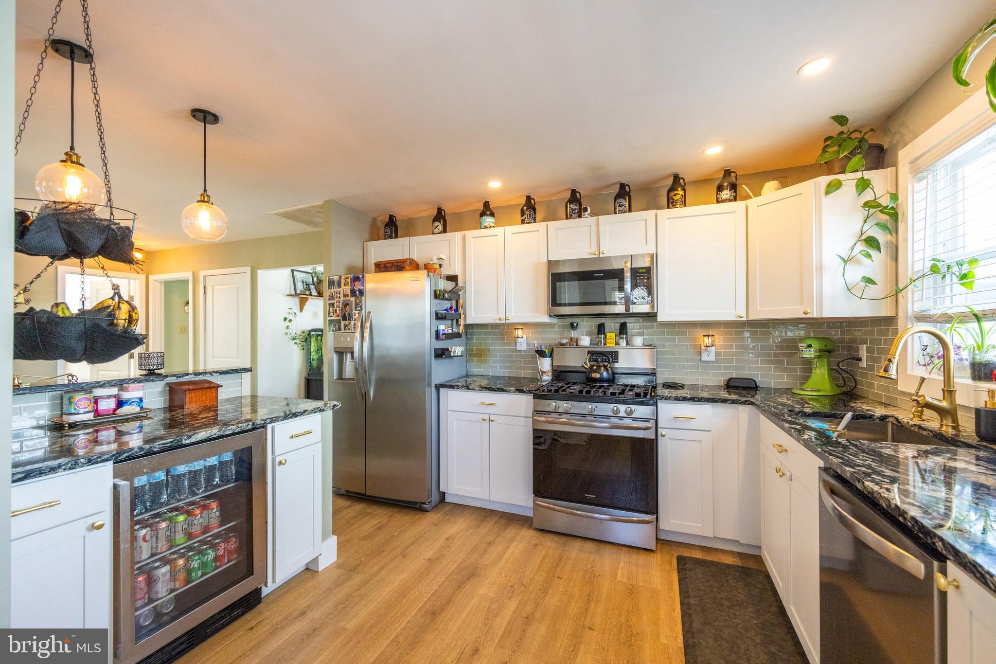178 Devon Drive West Deptford, NJ 08096 - Photo 8 of 29 a kitchen with stainless steel appliances granite countertop a stove a sink and a refrigerator
