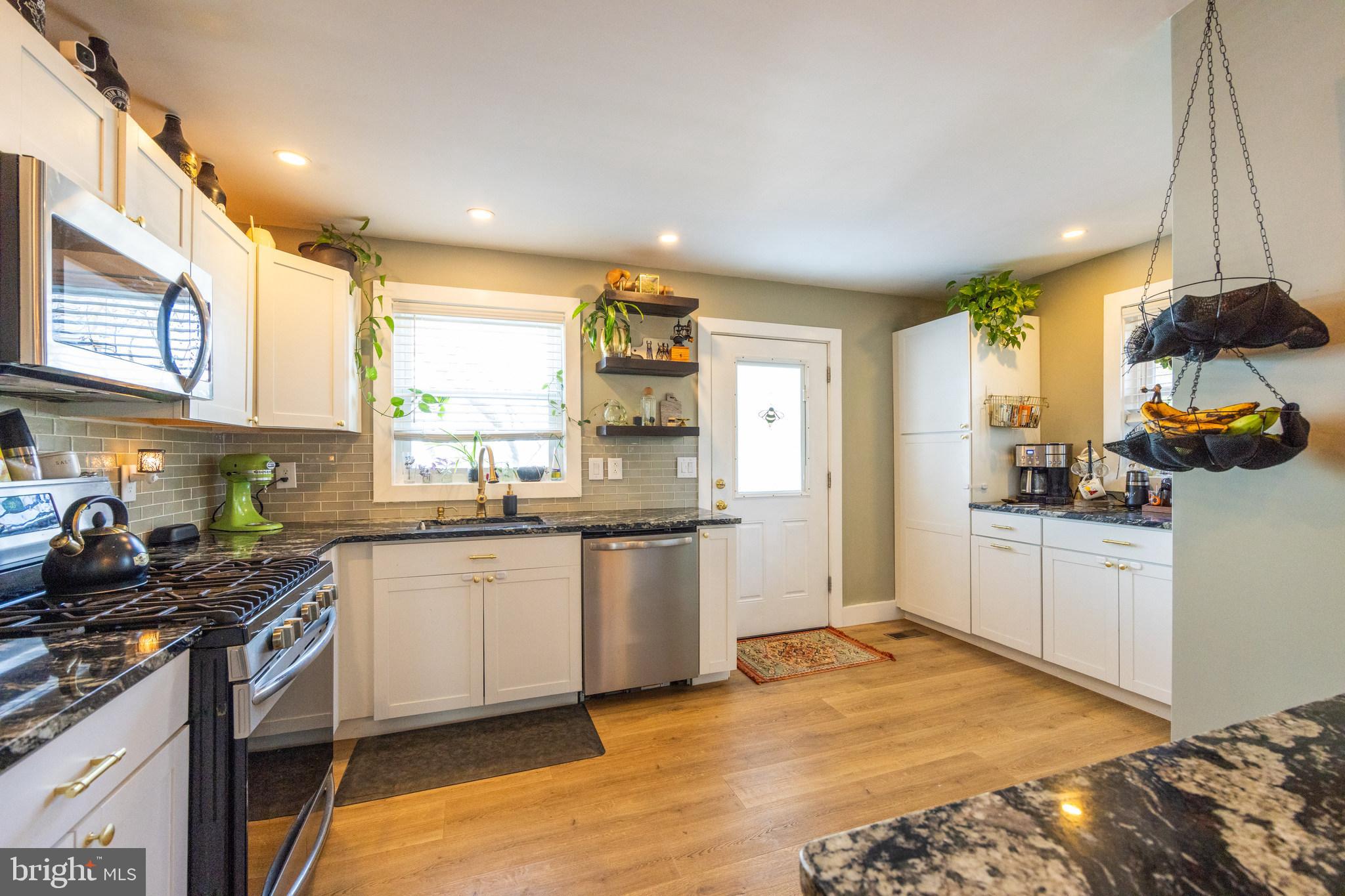 178 Devon Drive West Deptford, NJ 08096 - Photo 9 of 29 a kitchen with stainless steel appliances granite countertop a stove a sink and a refrigerator
