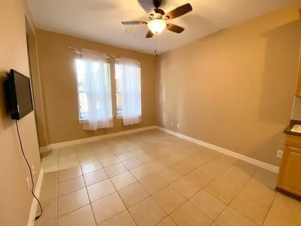 a view of an empty room with a window
