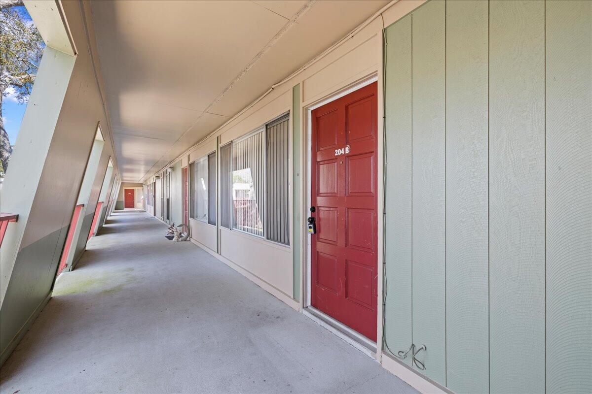 210 Pelham Road, Unit 204B Fort Walton Beach, FL 32547 - Photo 1 of 25 0-00-exterior_front_door