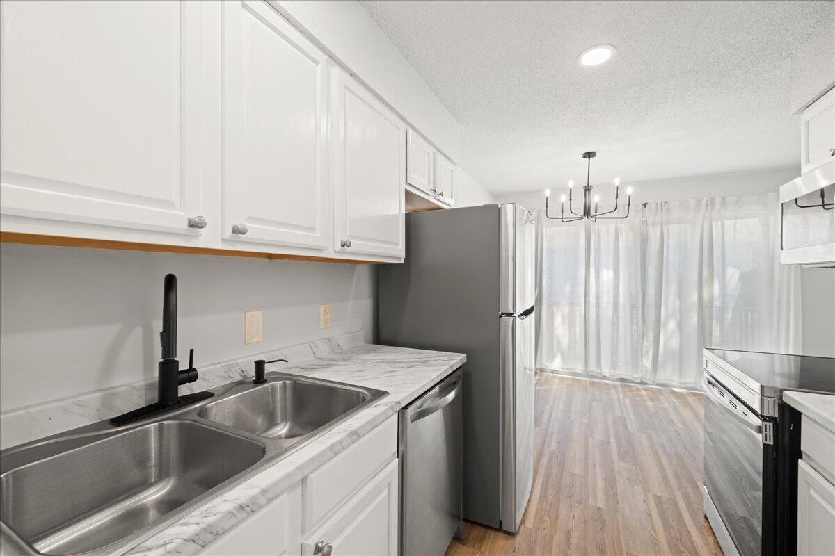 210 Pelham Road, Unit 204B Fort Walton Beach, FL 32547 - Photo 11 of 25 10-10-kitchen_faucet_from_pantry
