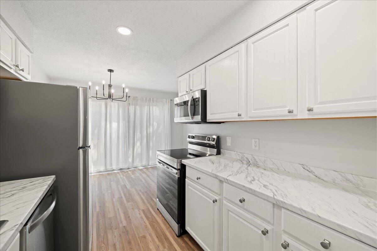 210 Pelham Road, Unit 204B Fort Walton Beach, FL 32547 - Photo 10 of 25 9-09-kitchen_from_pantry