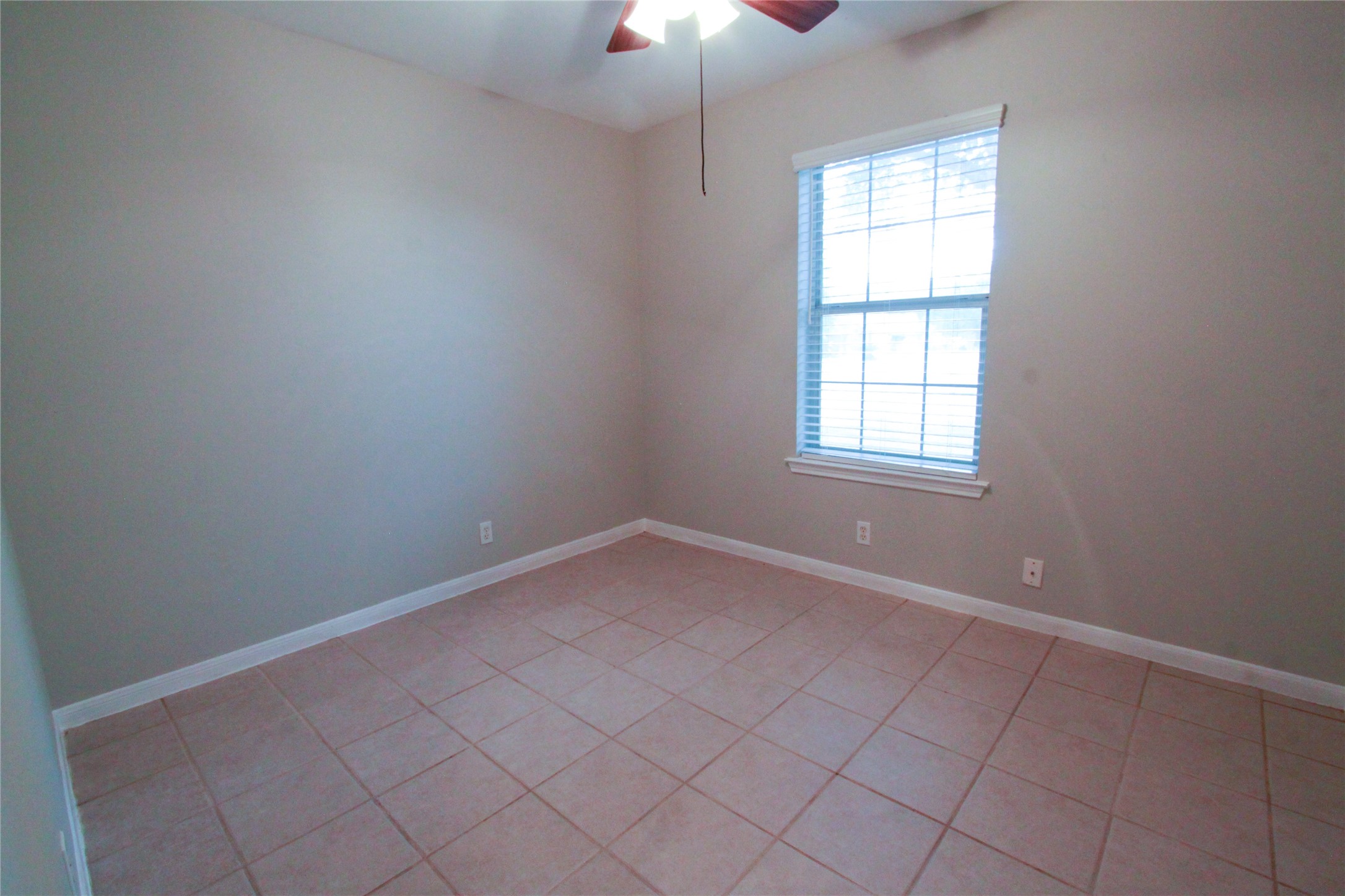 14708 Highsmith Street Austin, TX 78725 - Photo 20 of 28 Spare room with ceiling fan and light tile patterned floors