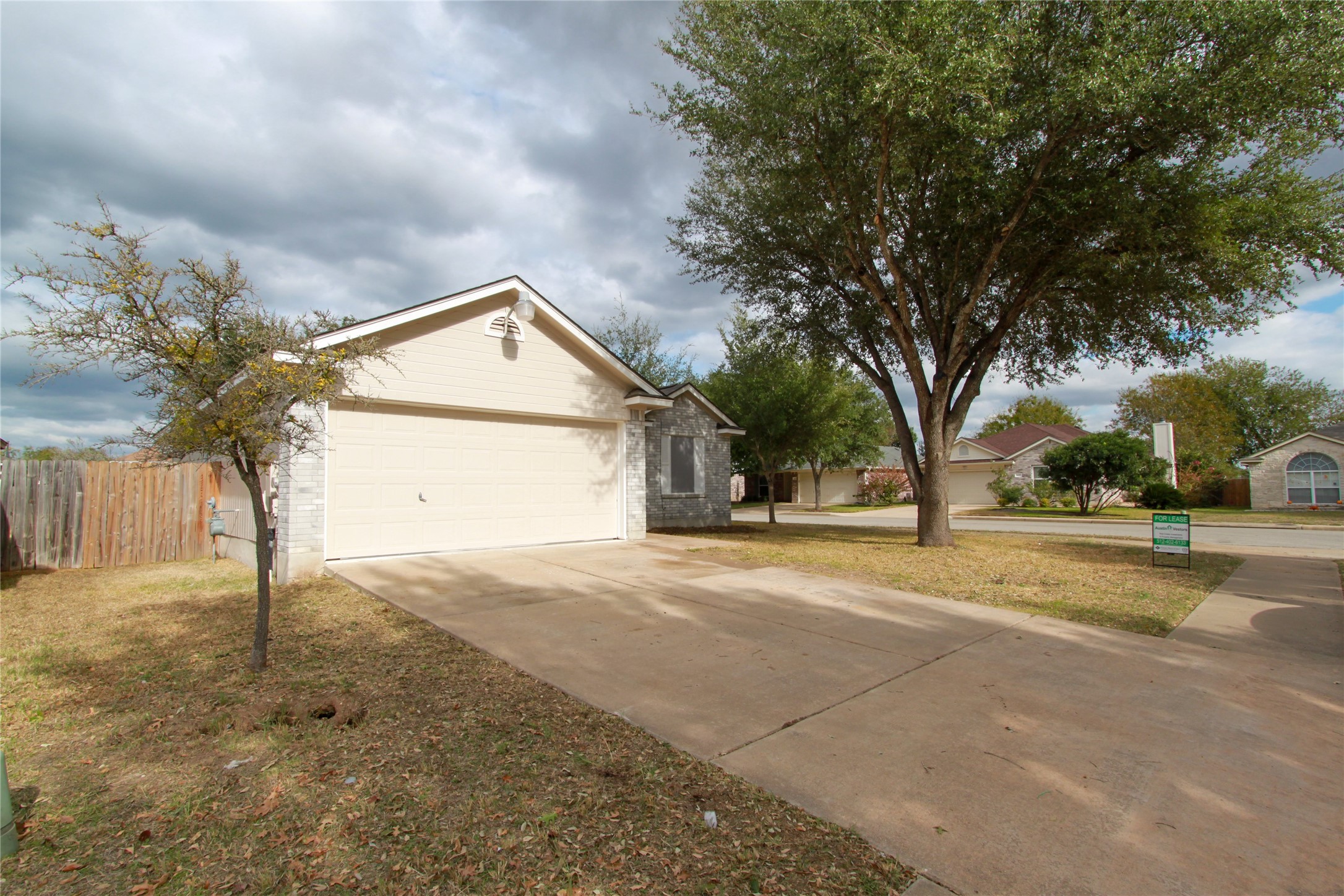 14708 Highsmith Street Austin, TX 78725 - Photo 2 of 28 View of front of home with driveway, an attached garage, and brick siding