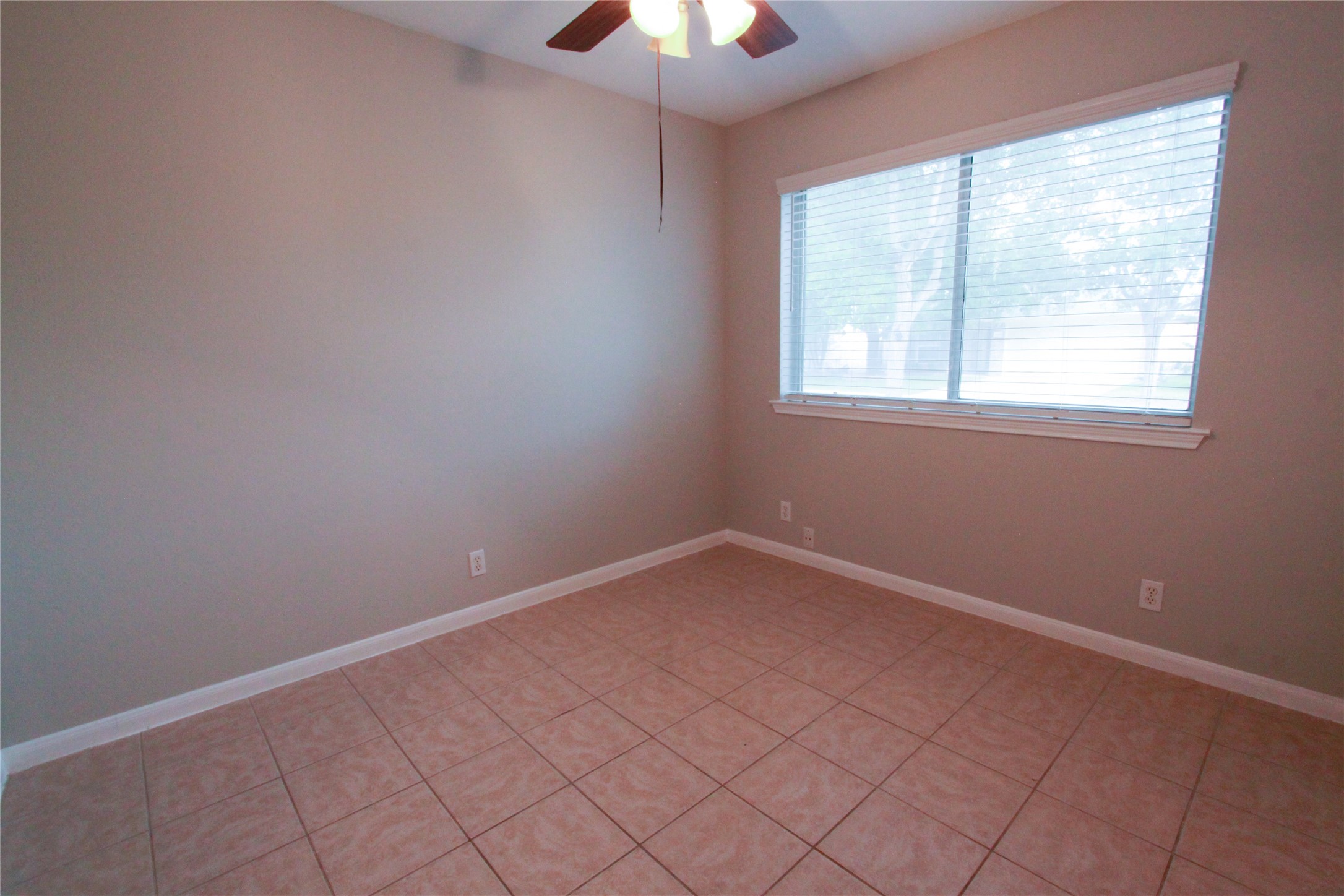14708 Highsmith Street Austin, TX 78725 - Photo 22 of 28 Spare room with ceiling fan and light tile patterned floors