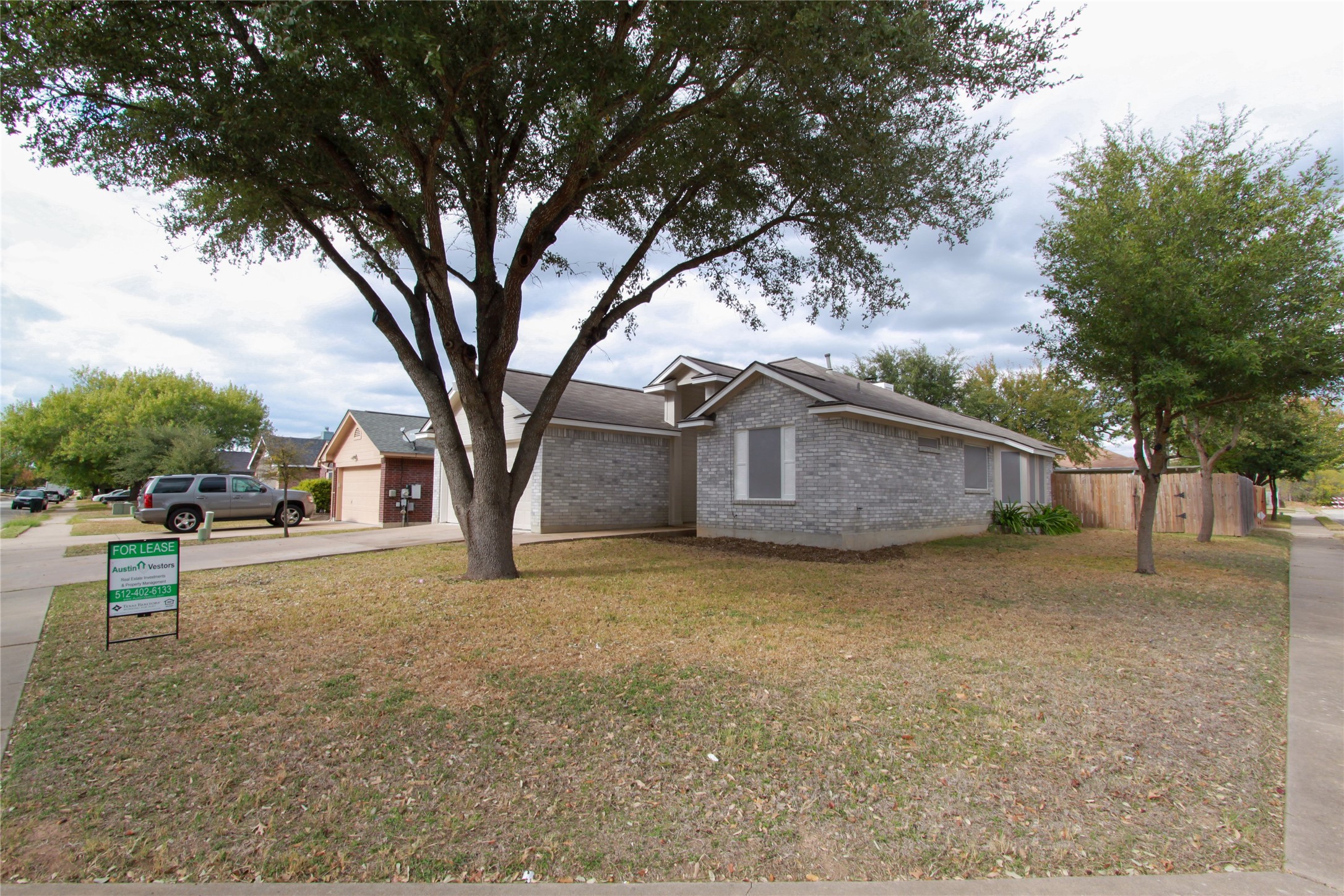 14708 Highsmith Street Austin, TX 78725 - Photo 3 of 28 View of front of home with brick siding and driveway