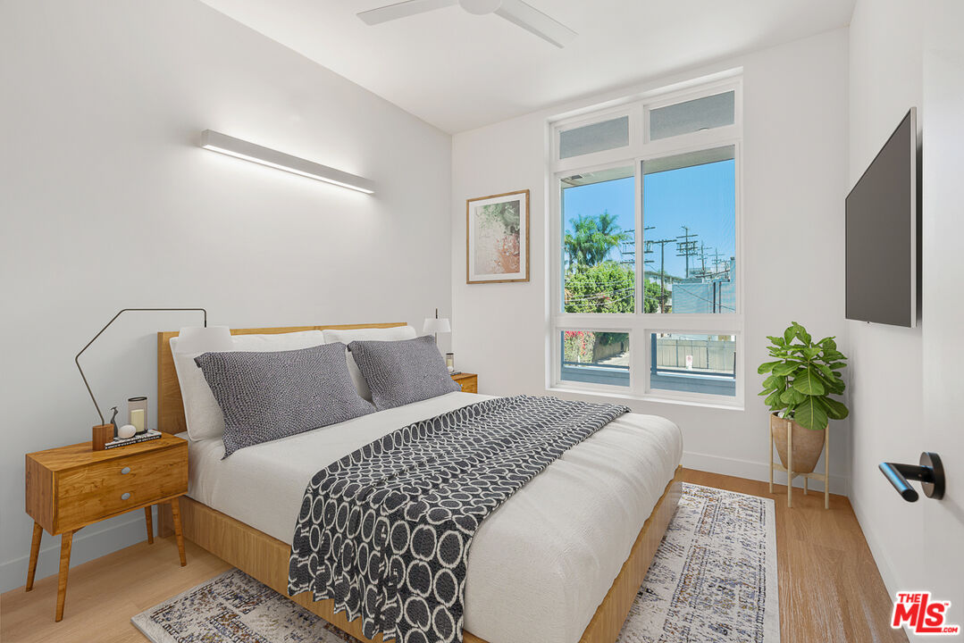 10601 Washington Boulevard, Unit 217 Culver City, CA 90232 - Photo 9 of 29 a bed sitting in a bedroom next to a window