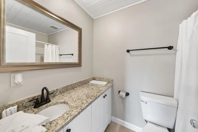 a bathroom with a shower and a tub